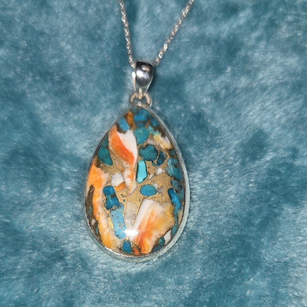 Elegant Silver Pendant Necklace with Turquoise and Orange Accents
